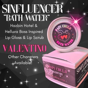 May include: A pink box and a small, round container with the text "SINFLUENCER BATH WATER" and "PAPI CHULO" are displayed. The container has a black label with a heart design. The box reads "VALENTINO" and "Strawberry Flavour".