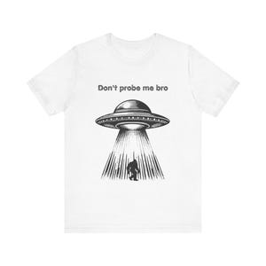 Out-of-This-World Humor: Alien Tee for UFO Enthusiasts, Unisex Short Sleeve Shirt, Ideal for Laughs and Casual Style