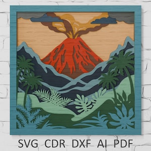 Puede incluir: Una obra de arte de madera en capas que representa un volcán en erupción, con palmeras y montañas. La obra de arte presenta un marco turquesa y una paleta de colores naranja, rojo, verde y azul. El texto "SVG CDR DXF AI PDF" está en la parte inferior.