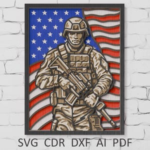 May include: A framed wooden artwork depicting a soldier in military uniform holding a rifle, set against an American flag. The artwork is layered with a detailed, three-dimensional effect. The text "SVG CDR DXF AI PDF" is at the bottom.