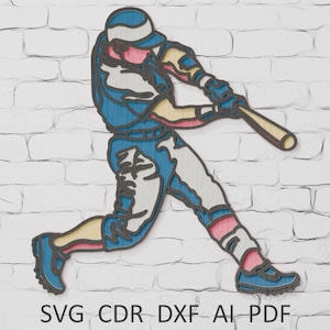 Pode incluir: Silhueta de madeira de um jogador de beisebol em ação, rebatendo. A figura é delineada em preto com detalhes em azul, branco, rosa e bege. A imagem é colocada contra uma parede de tijolos brancos. O texto na parte inferior diz "SVG CDR DXF AI PDF".