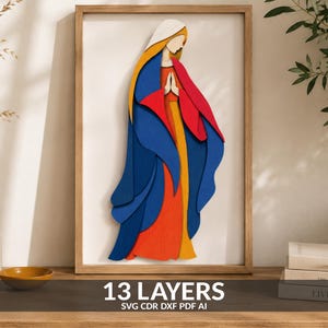 May include: A multi-layered wooden wall art piece depicting a stylized figure in prayer. The design features thirteen distinct layers in vibrant shades of blue, red, yellow, and white, framed in a light wood finish. The text 13 LAYERS SVG CDR DXF PDF AI is visible.