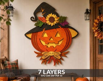 May include: A multi-layered wooden wall hanging featuring a carved orange jack-o'-lantern wearing a black witch hat adorned with a yellow sunflower and autumn leaves, with a bow at the base and the text 7 LAYERS SVG CDR DXF PDF AI.