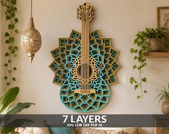 May include: A multi-layered wooden wall art piece shaped like a guitar, featuring intricate mandala-style cutouts in shades of turquoise, green, and natural wood. The design consists of seven distinct layers, creating a dimensional effect.