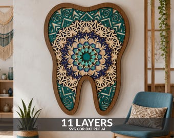 May include: A multi-layered wooden wall art piece shaped like a tooth, featuring intricate mandala-style cutouts in shades of teal, dark blue, and natural wood. The design consists of 11 layers, with the text 11 LAYERS SVG CDR DXF PDF AI visible.