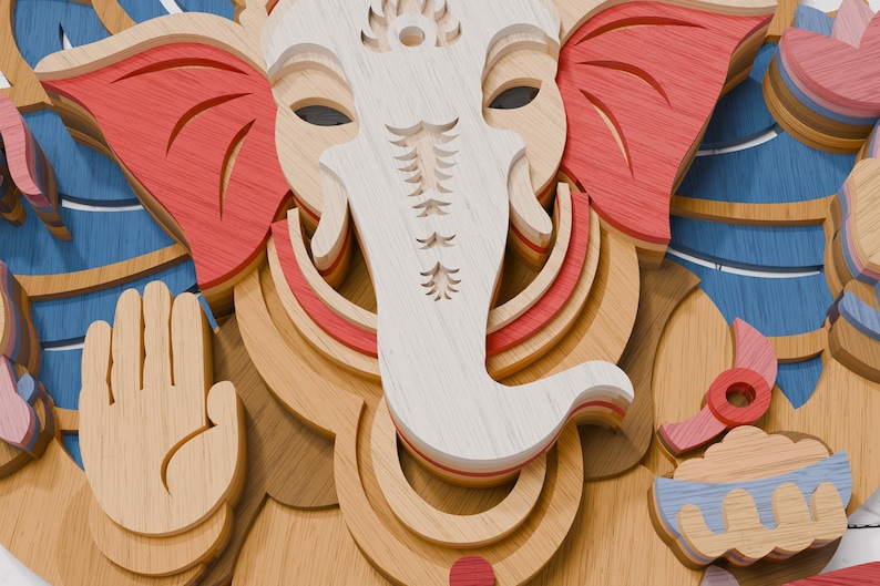 May include: A multi-layered wooden wall art piece depicting the deity Ganesha. The design features stacked laser-cut wood panels in natural light wood, red, and blue tones, showcasing Ganesha with an elephant head, trunk, and raised hand gesture.