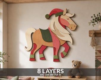 May include: A multi-layered wooden wall art piece depicting a horse wearing a red and green Santa hat, a green saddle, and green leg wraps. The horse features natural wood grain, red, and green tones. The text 8 LAYERS SVG CDR DXF PDF AI is visible.