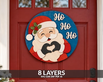 May include: A circular wooden door sign featuring a layered Santa Claus design with a red hat, white beard, and black gloves forming a heart shape. The background is blue with the text HO HO HO in white. The sign has eight distinct layers.