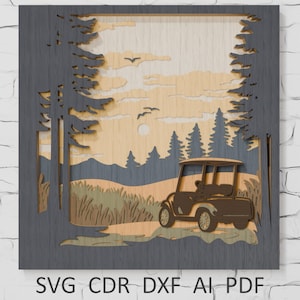 May include: Wooden layered art piece depicting a golf cart on a course at sunset. The artwork features a golf cart, trees, and a sun, with the text "SVG CDR DXF AI PDF" at the bottom. The piece is framed in a dark gray.