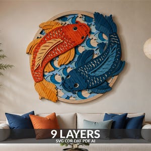 May include: A circular wooden wall art piece featuring two layered koi fish, one orange and one dark blue, swimming amidst stylized light blue waves. The design is composed of nine distinct layers, with the text 9 LAYERS SVG CDR DXF PDF AI visible.