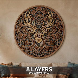 May include: A circular multi-layered wooden wall art piece featuring a central deer head silhouette surrounded by intricate mandala-style patterns in shades of natural wood, brown, and teal. The text 8 LAYERS SVG CDR DXF PDF AI is visible.