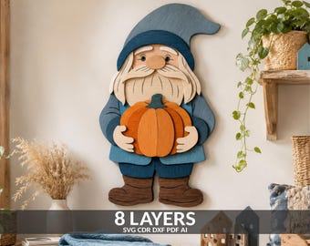 May include: A multi-layered wooden wall art piece depicting a gnome with a blue hat, a long beard, and brown boots, holding a large orange pumpkin. The design features 8 layers of wood, and the image includes the text 8 LAYERS SVG CDR DXF PDF AI.