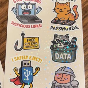 May include: A sticker sheet titled "Cyber Critters: Safety Edition" with various cartoon illustrations. Includes a laptop with the text "Stop Clicking Suspicious Links!", a cat protecting "Passwords", and a USB drive with "I Safely Eject!"