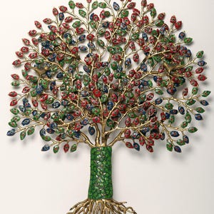 May include: A metal wall sculpture of a tree with a textured green trunk and exposed roots. The branches feature numerous leaves painted in red, blue, and green, with two small bird figures perched within the canopy of the tree structure.
