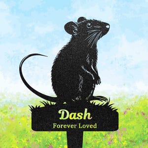 May include: A black silhouette of a rat standing on a rectangular garden stake. The stake features the text Dash in a light-coloured font, followed by the words Forever Loved in a smaller, matching font, set against a light blue and green background.