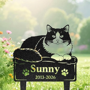May include: A black and white metal cat memorial garden stake featuring a resting cat silhouette. The rectangular base displays the name Sunny in a serif font, two paw print icons, and the years 2013-2026 engraved in a clear, legible style.