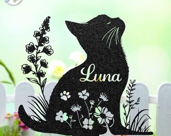 May include: Black metal garden stake featuring a silhouette of a cat with the name "Luna" in cursive script. The cat is surrounded by floral and paw print cutouts. The stake is designed to be placed in a garden or yard.