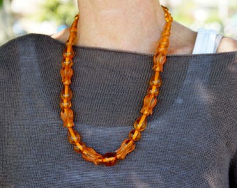 Applejuice Bakelite Carved Bead Necklace Translucent