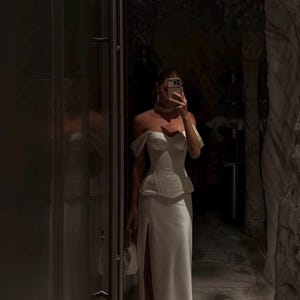 Satin corset with molded cups and adjustable straps paired with long flowing maxi skirt with side slit, high waist, elegant two-piece outfit for evening or special occasion