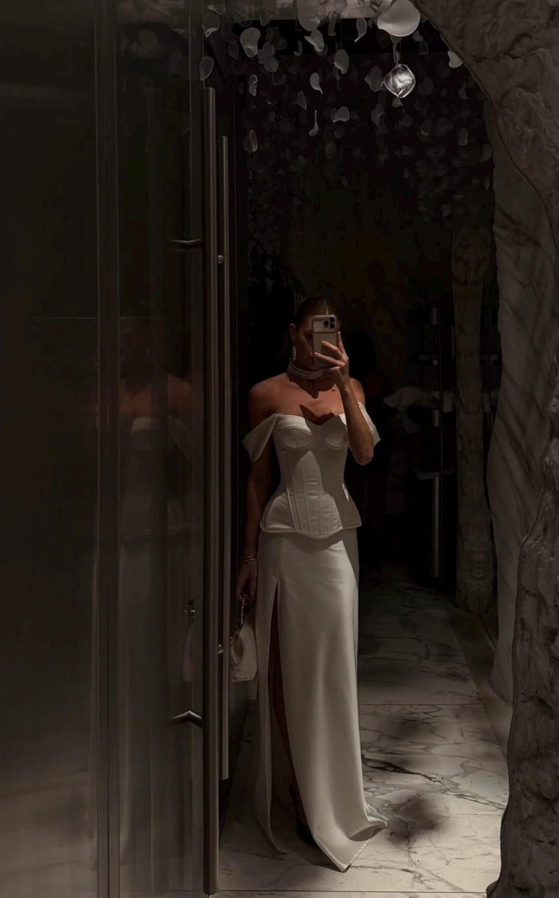 Satin corset with molded cups and adjustable straps paired with long flowing maxi skirt with side slit, high waist, elegant two-piece outfit for evening or special occasion