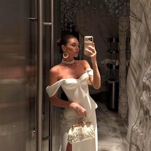 Satin corset with molded cups and adjustable straps paired with long flowing maxi skirt with side slit, high waist, elegant two-piece outfit for evening or special occasion
