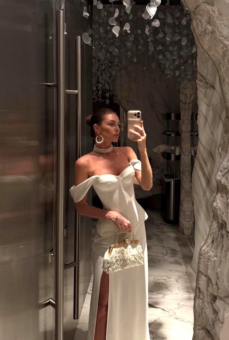 Satin corset with molded cups and adjustable straps paired with long flowing maxi skirt with side slit, high waist, elegant two-piece outfit for evening or special occasion