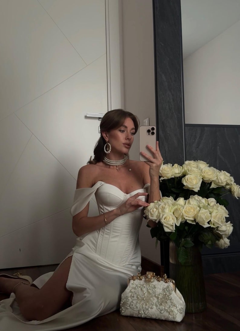 Satin corset with molded cups and adjustable straps paired with long flowing maxi skirt with side slit, high waist, elegant two-piece outfit for evening or special occasion