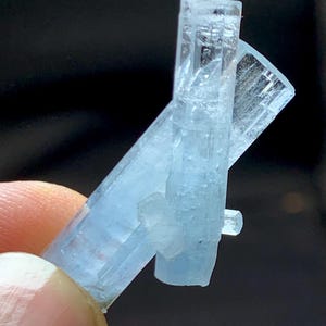 May include: A set of three ceramic mugs with a speckled, matte finish. The mugs are in shades of cream, light gray, and dark gray. Each mug has a simple, minimalist design, perfect for coffee or tea.