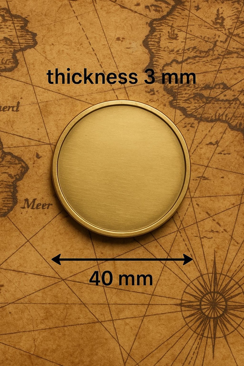 May include: A circular, brushed gold-tone metal coin or disc with a raised outer rim. The object features a diameter of 40 mm and a thickness of 3 mm, as indicated by the text and measurement arrows printed directly on the image.