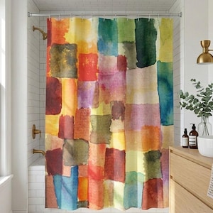 May include: A colorful shower curtain with a patchwork design. The curtain features a watercolor effect with squares of red, orange, yellow, green, purple, and blue. The bathroom has a white tiled wall, a wooden vanity, and a round mirror.