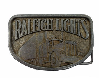 Vintage Raleigh Lights Belt Buckle Metal Trucker Semi Truck 18 Wheeler