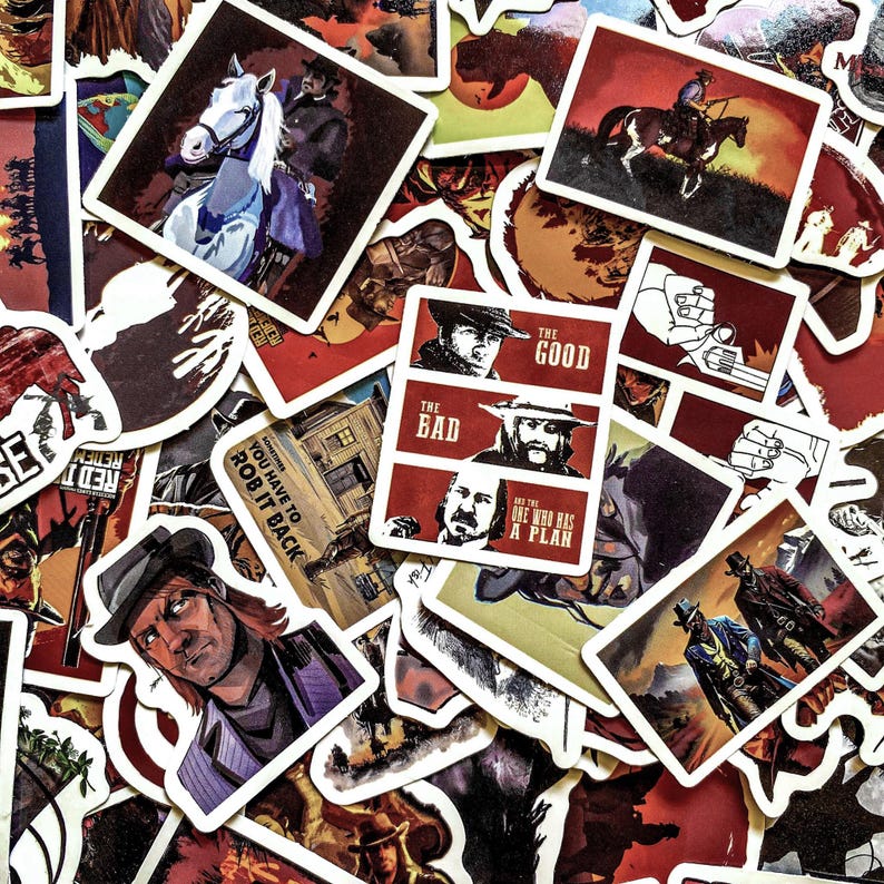 May include: A collection of Western-themed stickers with illustrations of cowboys, horses, and text. The stickers feature a variety of designs, including portraits, action scenes, and text like "The Good, The Bad, and The One Who Has A Plan."