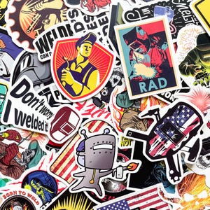 May include: A collection of colorful stickers featuring welding themes. Designs include a welder with a torch, a robot welder, and text like "RAD" and "Don't worry, I welded it!" The stickers have a variety of shapes and sizes.