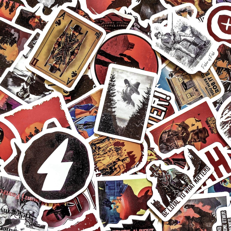 May include: A collection of assorted stickers with a Western theme. The stickers feature illustrations of cowboys, playing cards, and text like "Be Loyal to What Matters" and "Red Redemption". The color palette includes red, brown, and black.