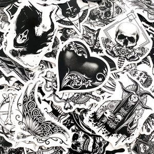 May include: A collection of black and white stickers with gothic and occult themes. Designs include skulls, moths, a heart with floral accents, and illustrations of demons and other dark imagery. The stickers are arranged in a random pattern.