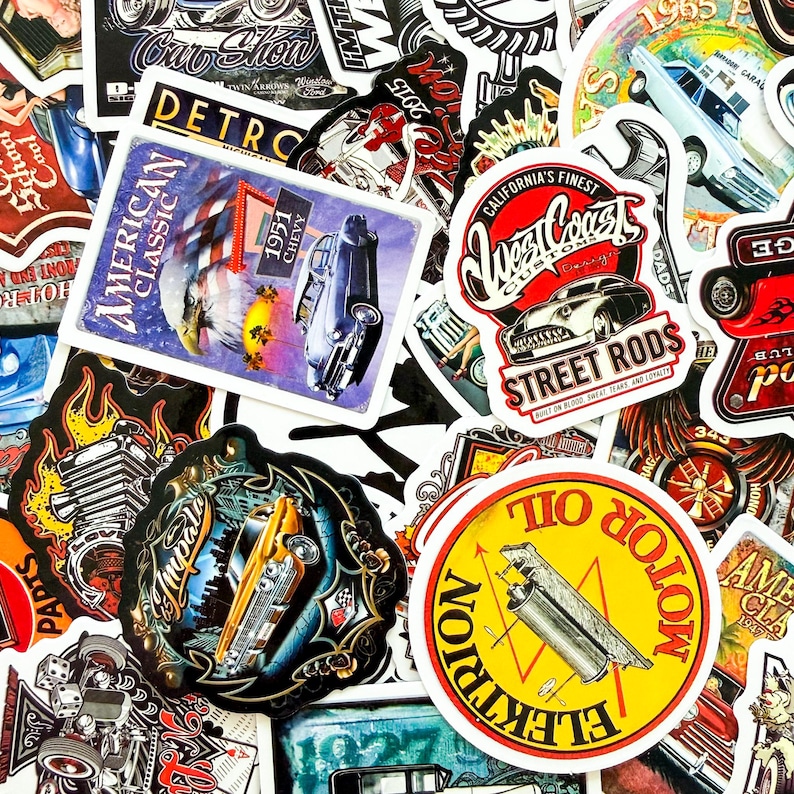 May include: A collection of vintage-style stickers featuring classic cars, hot rods, and automotive-themed designs. The stickers showcase various colors, including red, yellow, blue, and black, with text such as "American Classic" and "Motor Oil".
