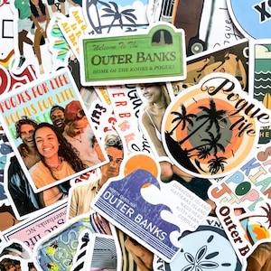 May include: A collection of colorful stickers featuring text and graphics. Designs include palm trees, sunsets, waves, and the text "Outer Banks," "Pogues for Life," and "Welcome to the Outer Banks." The stickers have a variety of shapes and sizes.