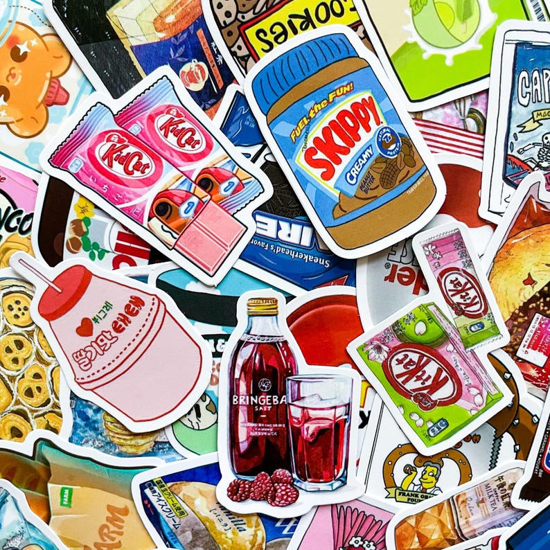 May include: A collection of colorful stickers featuring food and drink items. Stickers include Kit Kat bars, a jar of Skippy peanut butter, a bottle of Bringeba Saft, and a pink drink with Korean text.
