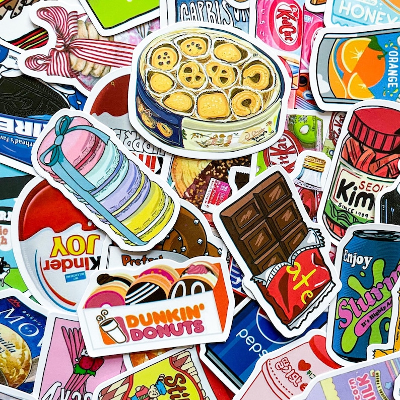 May include: A collection of colorful stickers featuring various food and drink items. Stickers include a box of cookies, a stack of macarons, a chocolate bar, a can of soda, and a box of donuts. Other stickers include the words "Kinder Joy" and "Dunkin' Donuts".