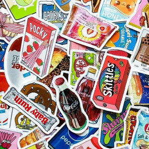 May include: A collection of colorful stickers featuring various snack and beverage brands. Notable items include Pocky, Skittles, Coca-Cola, and Baby Ruth. The stickers showcase vibrant packaging designs and food illustrations, perfect for decorating.