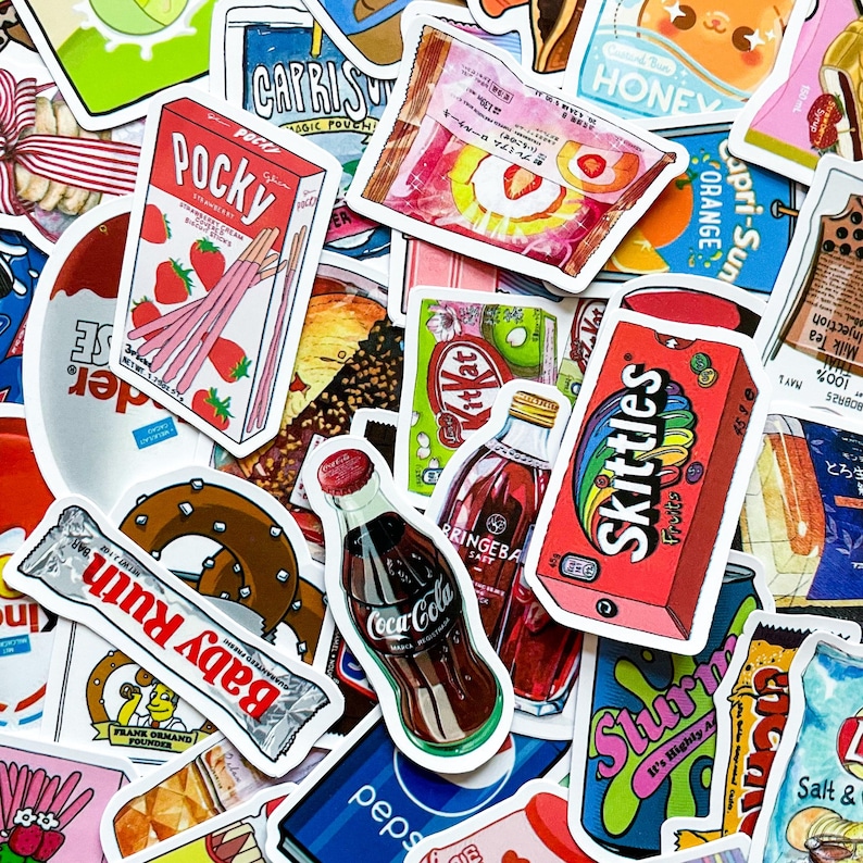 May include: A collection of colorful stickers featuring various snack and beverage brands. Notable items include Pocky, Skittles, Coca-Cola, and Baby Ruth. The stickers showcase vibrant packaging designs and food illustrations, perfect for decorating.