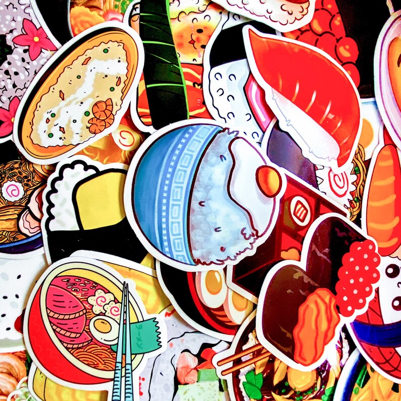 May include: A collection of colorful stickers featuring various Japanese food illustrations. The stickers include images of sushi, ramen, rice bowls, and other traditional dishes. The designs are vibrant and detailed, with a cartoonish style.