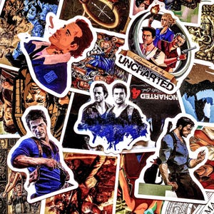 May include: A collection of Uncharted video game stickers featuring various characters and scenes. The stickers showcase characters in action poses, with vibrant colors and detailed artwork. Some stickers include the game's logo and title.
