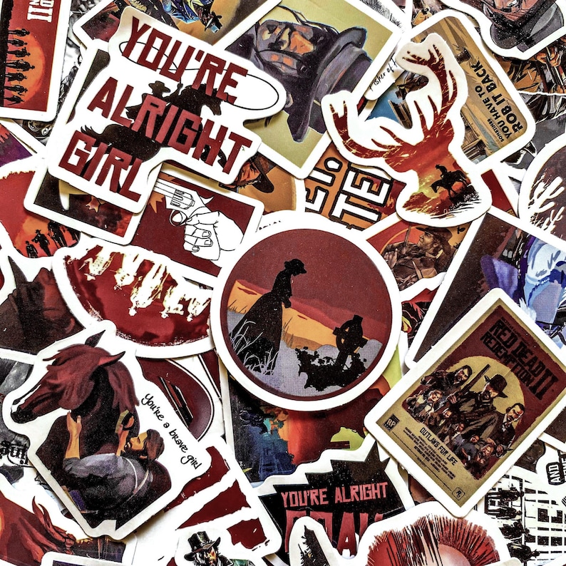 May include: A collection of Western-themed stickers with various designs and text. Stickers include images of cowboys, horses, and the text "YOU'RE ALRIGHT GIRL" and "RED DEAD REDEMPTION II". The color palette includes red, brown, and white.