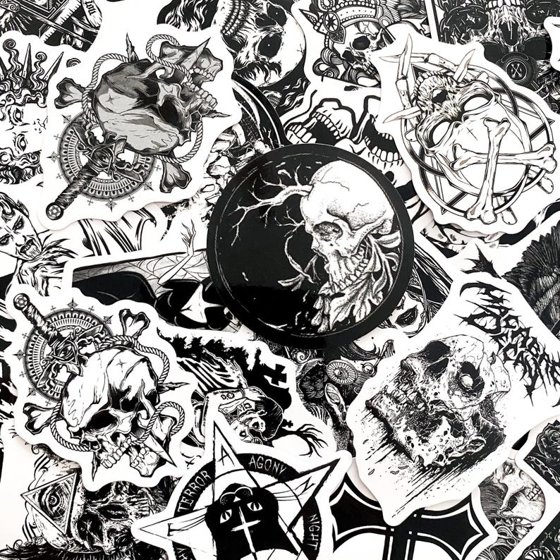 May include: A collection of black and white stickers featuring skull illustrations, daggers, and gothic symbols. The stickers vary in shape and size, with intricate details and a dark aesthetic. Some stickers include text like "Terror" and "Agony".