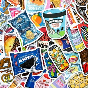 May include: A collection of colorful stickers featuring various food and beverage brands. Stickers include a bag of sea salt chips, an ice cream container, a sneaker-themed cookie, and an Arizona iced tea can.