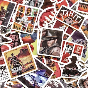 May include: A collection of stickers featuring imagery from the video game Red Dead Redemption. The stickers showcase characters, scenes, and the game's logo in various designs. Colors include red, brown, and yellow.