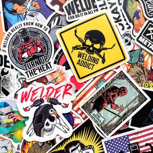 May include: A collection of colorful stickers with welding-themed designs. The stickers feature images of welders, skulls, and text like "Welding Addict" and "Turn Up The Heat". The stickers are in various shapes and sizes, with a mix of bold colors and graphic illustrations.