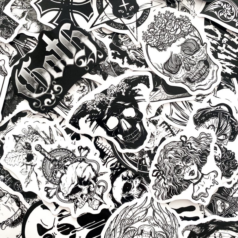 May include: A collection of black and white stickers featuring gothic and macabre designs. The stickers include skulls, floral elements, and text, creating a dark and artistic aesthetic. The stickers are of various shapes and sizes.