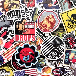 May include: A collection of colorful stickers with welding-themed designs. The stickers feature images of welders, welding tools, and text like "Welder" and "When the Hood Drops." The stickers are in various shapes and sizes.